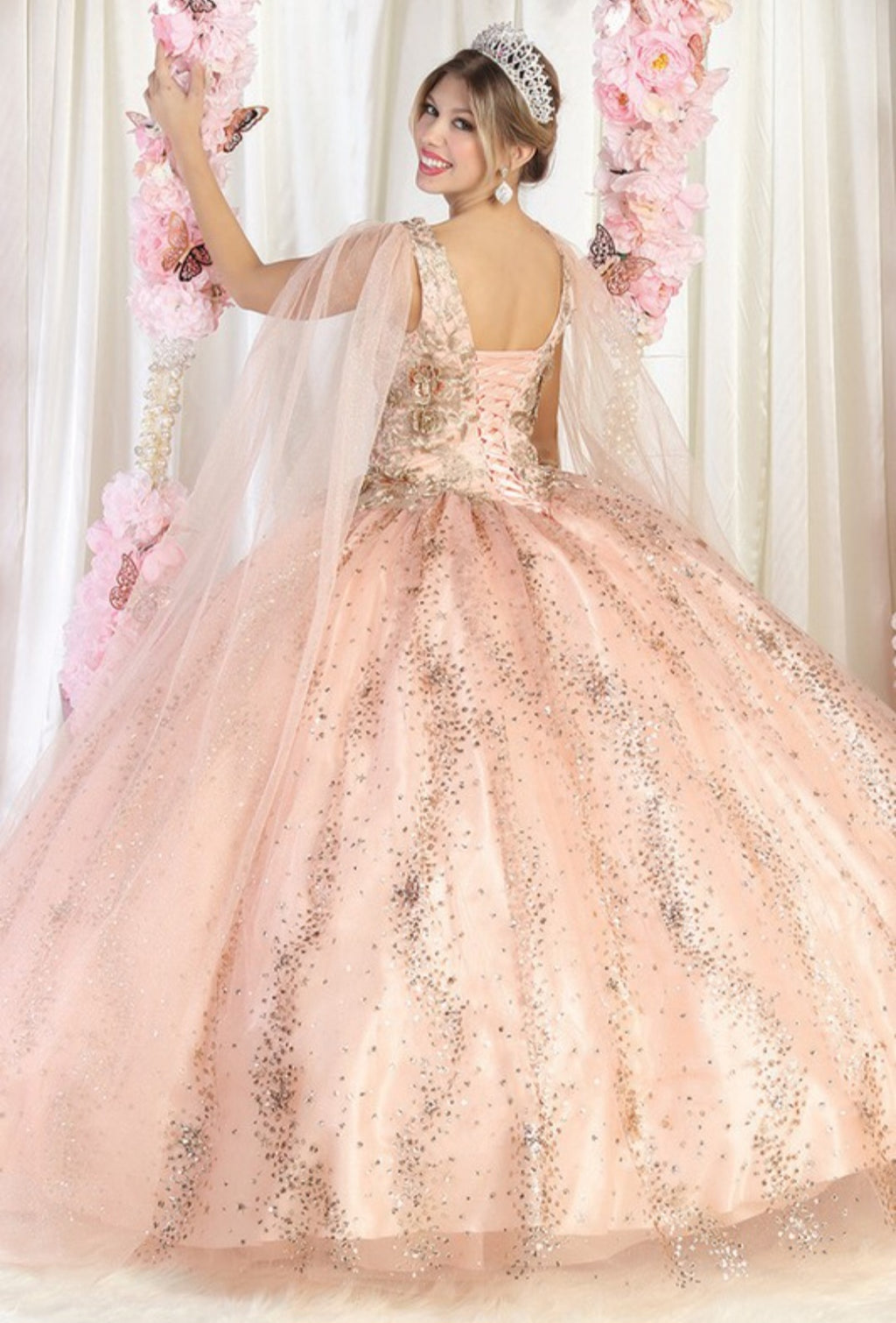 Rose gold quinceanera dress with gold glitter and sparkly crystals