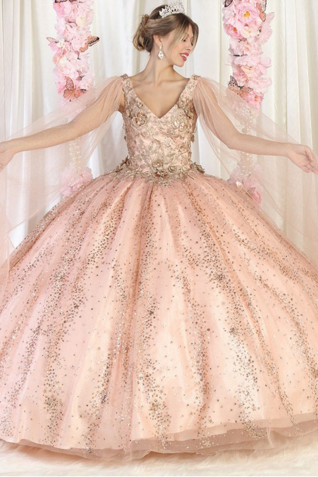 Rose gold quinceanera dress with gold glitter and sparkly crystals