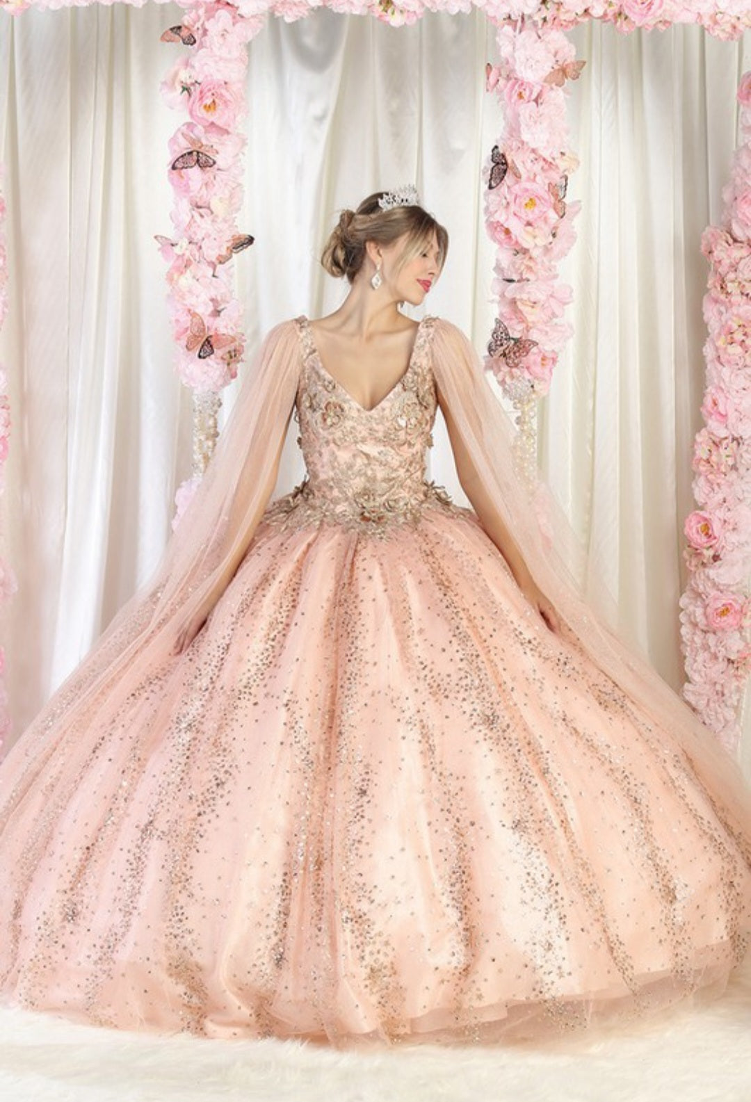Rose gold quinceanera dress with gold glitter and sparkly crystals